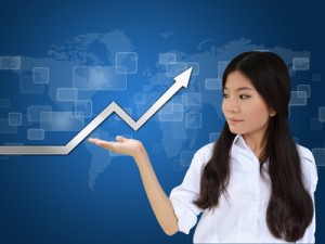 Business woman and a graph showing growth of business