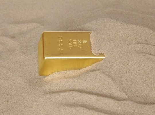 of gold buried in sand bar