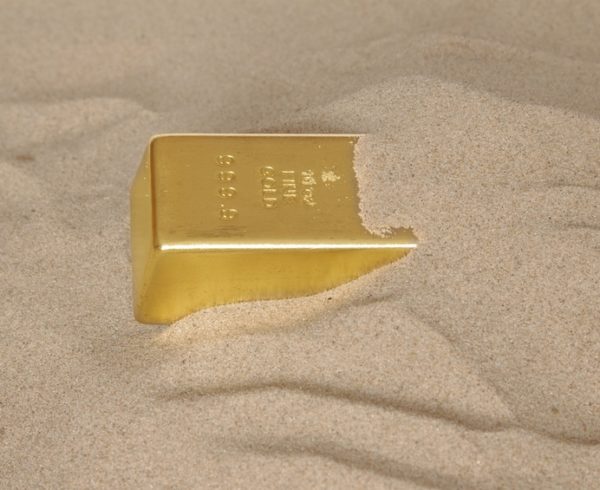 of gold buried in sand bar